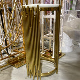 Table round stand (gold plinth) beside Backdrop