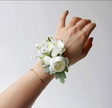 White boutonnière corsages for bride groom best men mother ranunculus head band